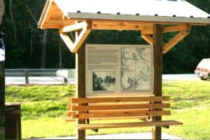 Informational Wooden Park Pole Sign with Bench and Awning